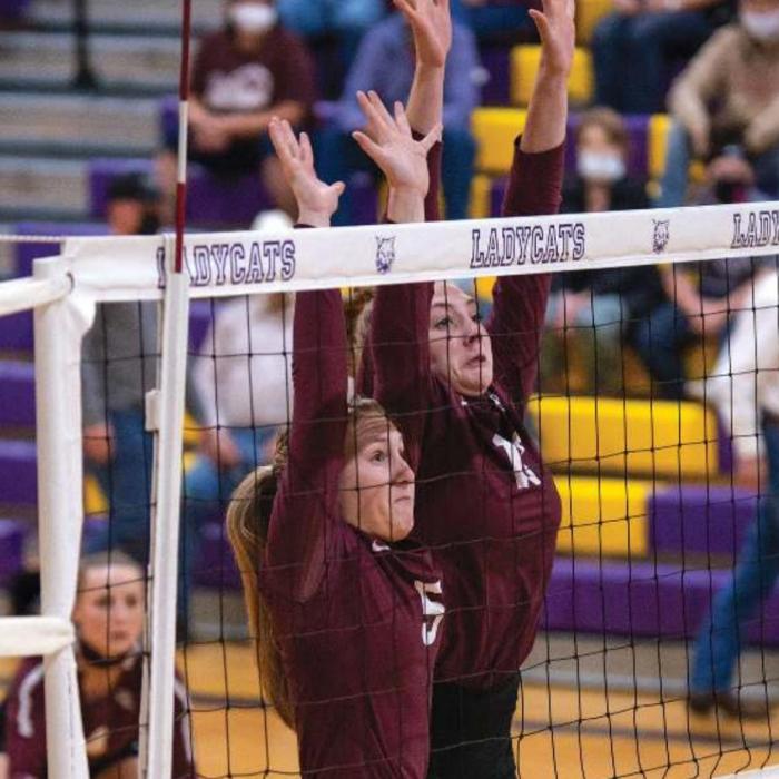 Flatonia’s Mollie Mica and Carly Siptak at the net for a block earlier this season. Photo by Stephanie Steinhauser