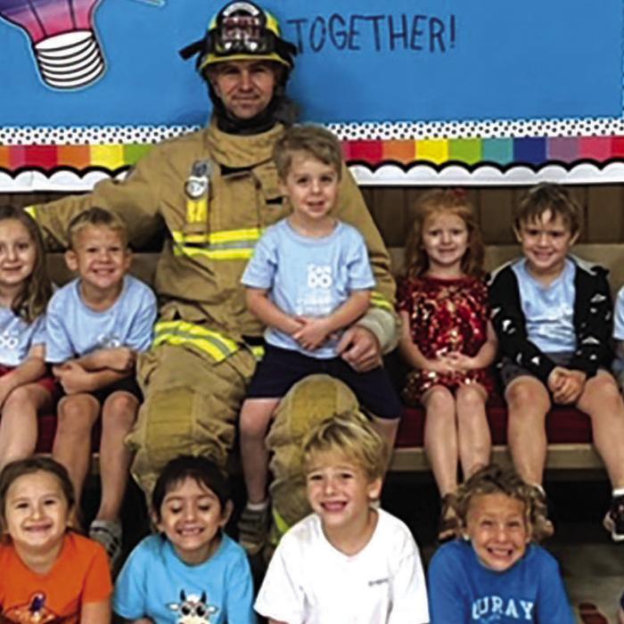 Local firefighter Josh Tiemann recently gave a talk to Mt. Calvary Lutheran Preschool students about fire safety.