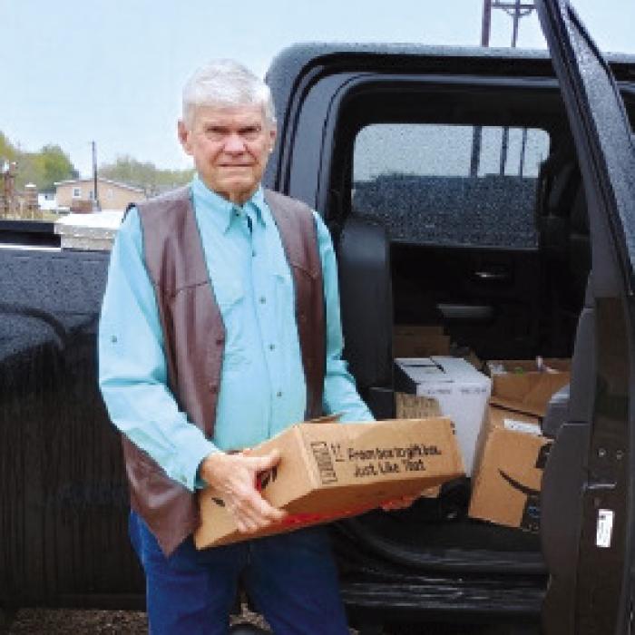 American Legion Post No. 338 Vice-Commander Marvin Wessels loads the food donations collected by the post and auxiliary during their meeting held on Dec. 5.