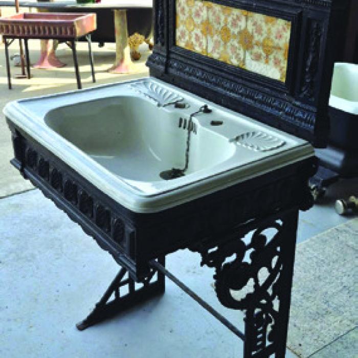 This china sink is English c. 1890, set in a fancy cast iron frame.