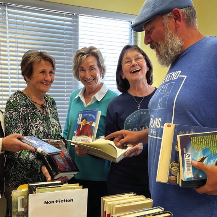 Friends of the Schulenburg Library members (left to right) Jenny Kubenka, Joyce Kobza, Diana Mikesky and Kristy Clark, offer reading recommendations to Kenneth Couch of Schulenburg on day one of their annual book sale. Drop by the Schulenburg Library this week and make your choices: Monday 10 a.m.-8 p.m., Tuesday-Friday 10 a.m.-6 p.m. or Saturday 9 a.m.-noon. Prices are reasonable and proceeds support the library. Photo by Elaine Thomas