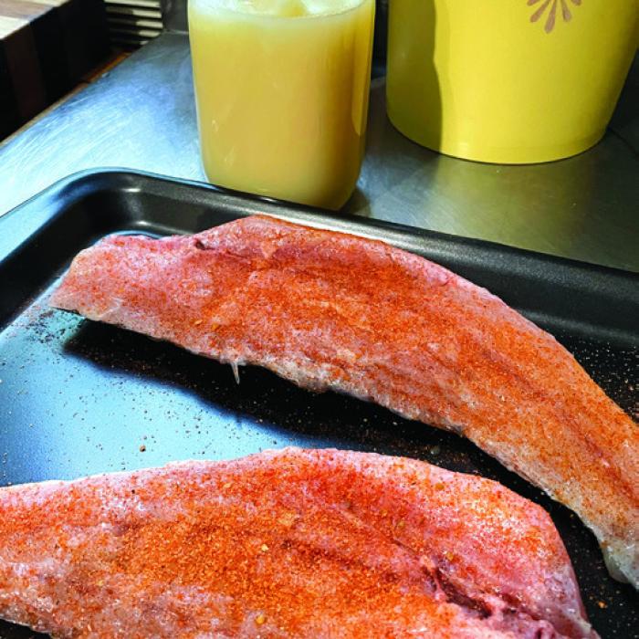 A pair of seasoned redfish halfshells with a quart jar of beef tallow I made last weekend.