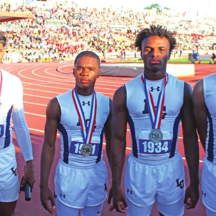 The La Grange relay team of, left to right: Bravion Rogers, Jordan Scott, Dana Baker and Trey East. Photos by Jeff Wick