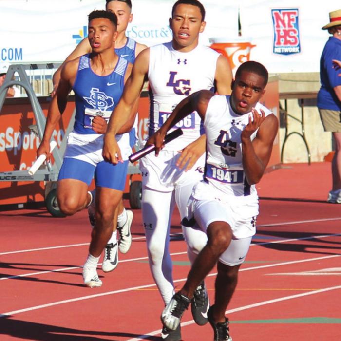 La Grange senior Trey East hands off the baton to fellow senior Jordan Scott during the 4x200 relay Thursday in Austin. The Leps broke a six-year-old old state record with their time, but Waco La Vega as even faster. Photo by Jeff Wick
