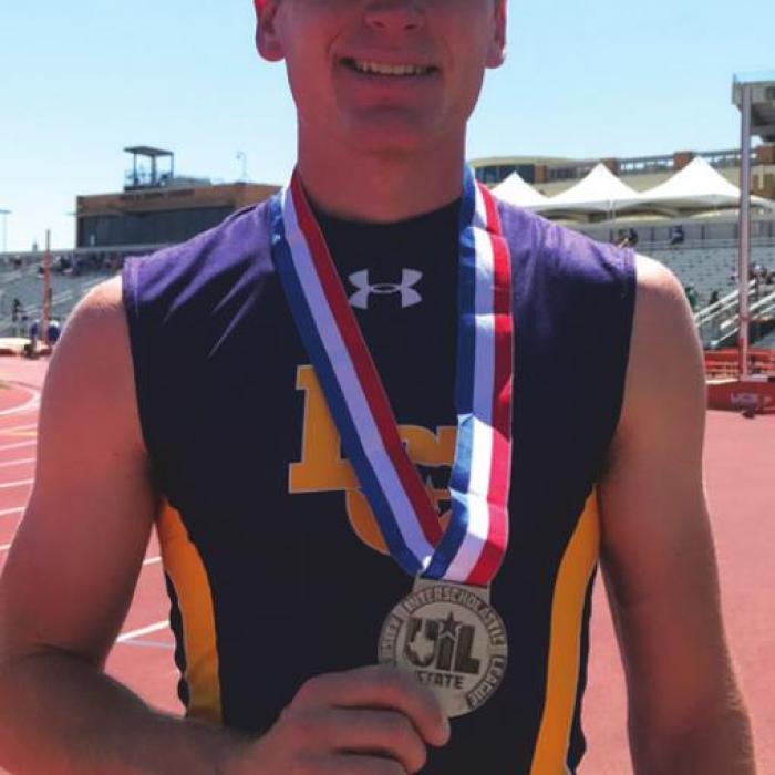 La Grange’s Dylan Truss holds up his state silver medal.