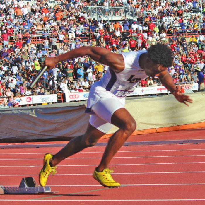 La Grange’s Dana Baker at the start of the boys 4x200 relay.