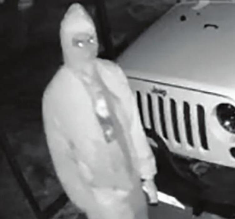 Home surveillance footage captured this image of one of the burglars breaking into a four-door Jeep on Lester Street early Tuesday morning. Pistols were taken from two other vehicles that were burglarized that morning.