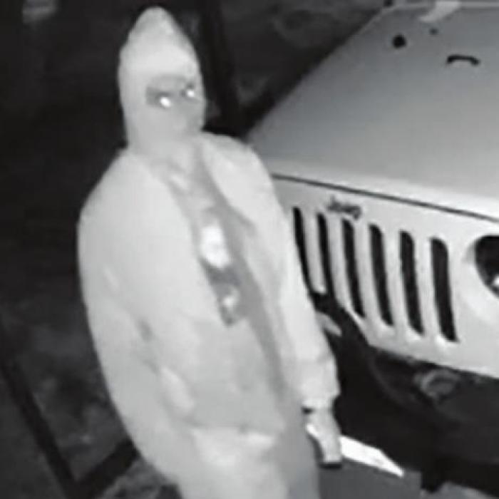 Home surveillance footage captured this image of one of the burglars breaking into a four-door Jeep on Lester Street early Tuesday morning. Pistols were taken from two other vehicles that were burglarized that morning.