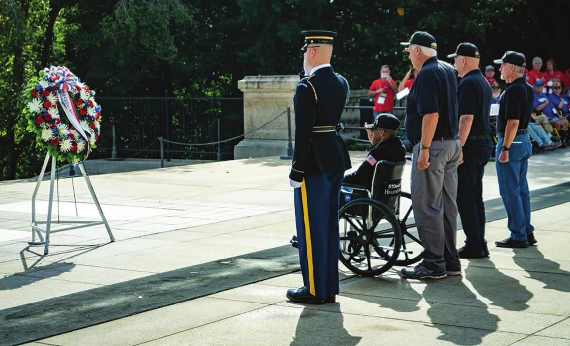 Muldoon’s Patrick Lyons (standing directly behind the wheelchair) was one of four veterans chosen to place a wreath at the Tomb of the Unknown Soldier in Washington D.C. during his recent honor flight there. For more on his service and his trip, see page A6.