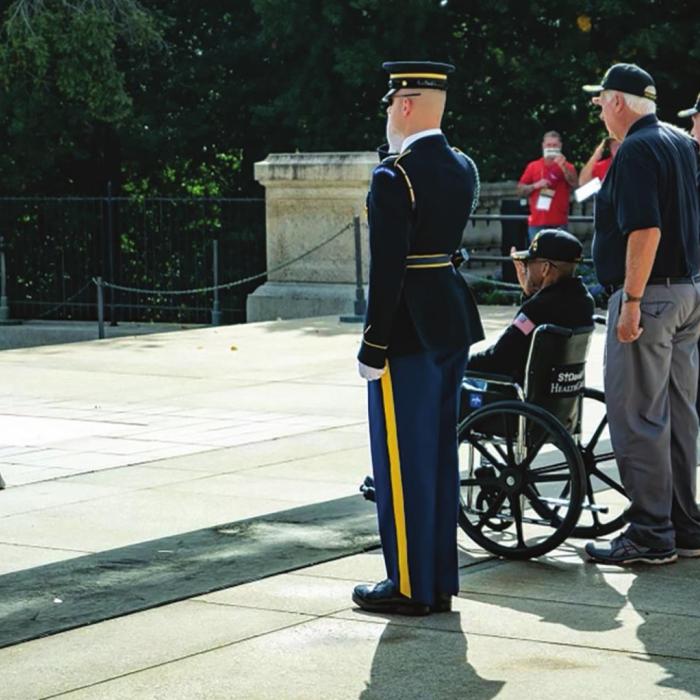 Muldoon’s Patrick Lyons (standing directly behind the wheelchair) was one of four veterans chosen to place a wreath at the Tomb of the Unknown Soldier in Washington D.C. during his recent honor flight there. For more on his service and his trip, see page A6.