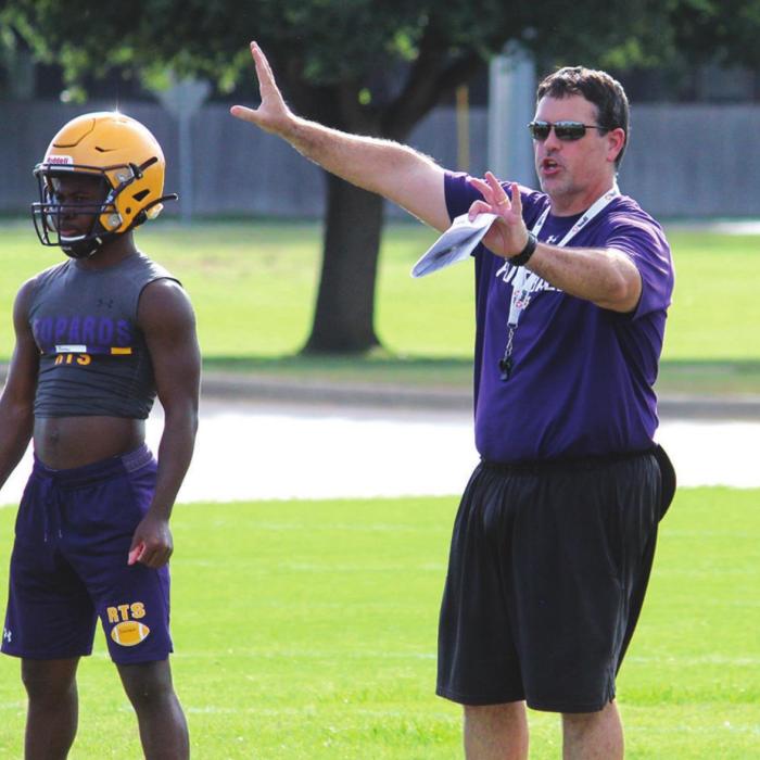 Football practice got underway Monday at La Grange High school. Left, new La Grange defensive coordinator William McGonagle oversees tackling drills. Right, La Grange head coach Matt Kates directs his players during practice Monday, his record 12th season as Leps’ head coach. Photos by Jeff Wick