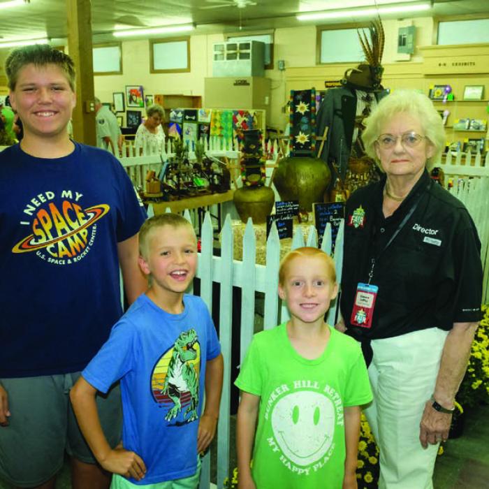 BEST OF THE COLLECTIBLES DEPARTMENT Pictured (from left) are Daniel, Caleb and Johann Lehmann - junior division, and Glenna Laffey - 70 and above. Not pictured were Cara Homer - teen division and Ron Booker - adult division.