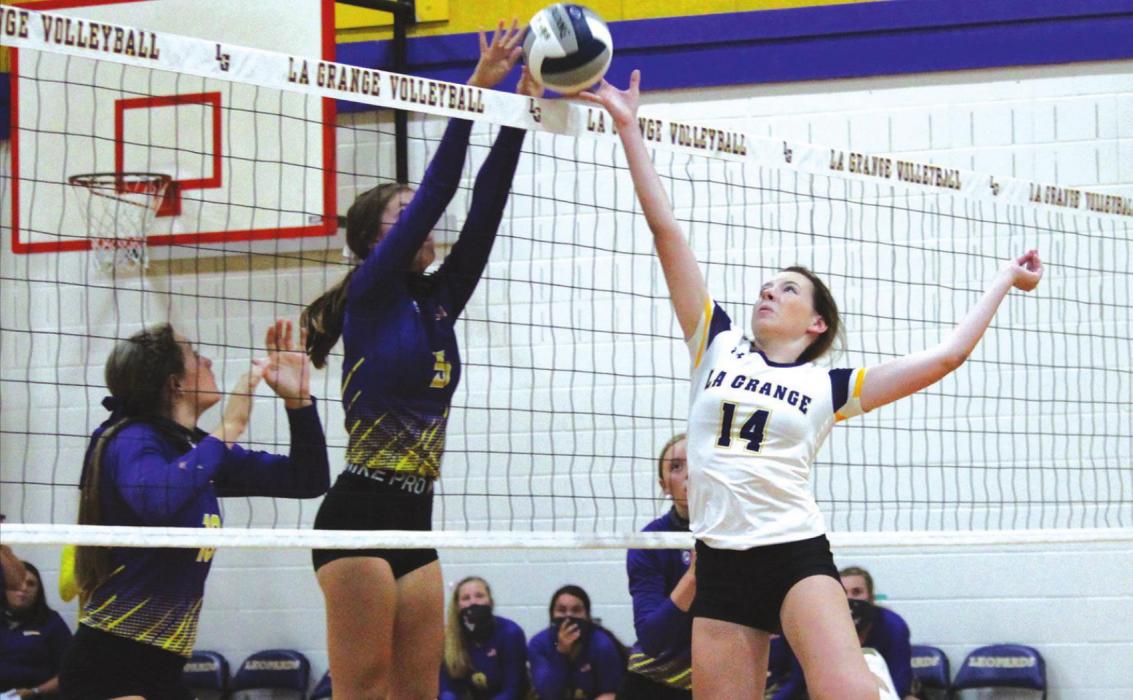 La Grange’s Hailey Hill, right, battles at the net against Weimar Tuesday. Photo by Jeff Wick
