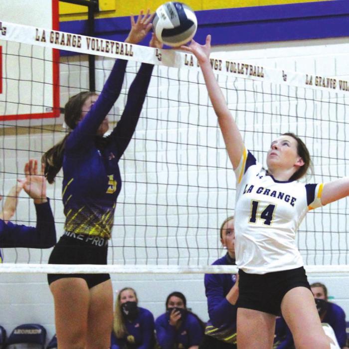 La Grange’s Hailey Hill, right, battles at the net against Weimar Tuesday. Photo by Jeff Wick
