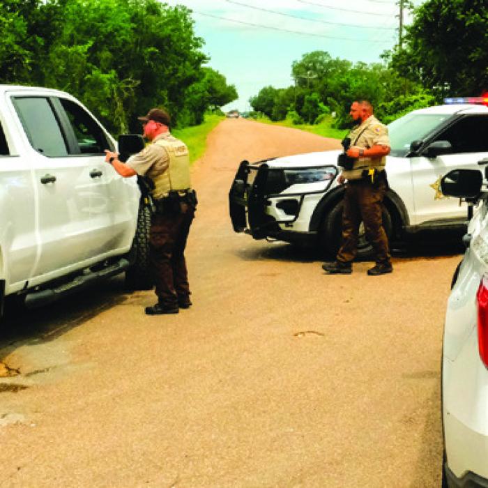 Fayette County Sheriff’s deputies blocked Old Plum Highway ahead of the scene of Wednesday’s fatal shooting. Photo by Andy Behlen