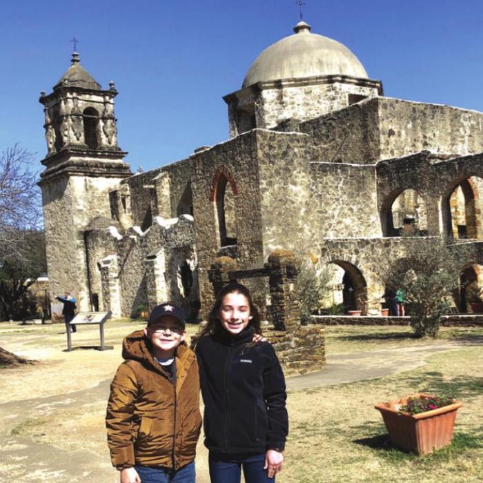 FISD students Ethan Keilers (Grade 4) and Emily Keilers (Grade 7) in front of Mission San Jose.