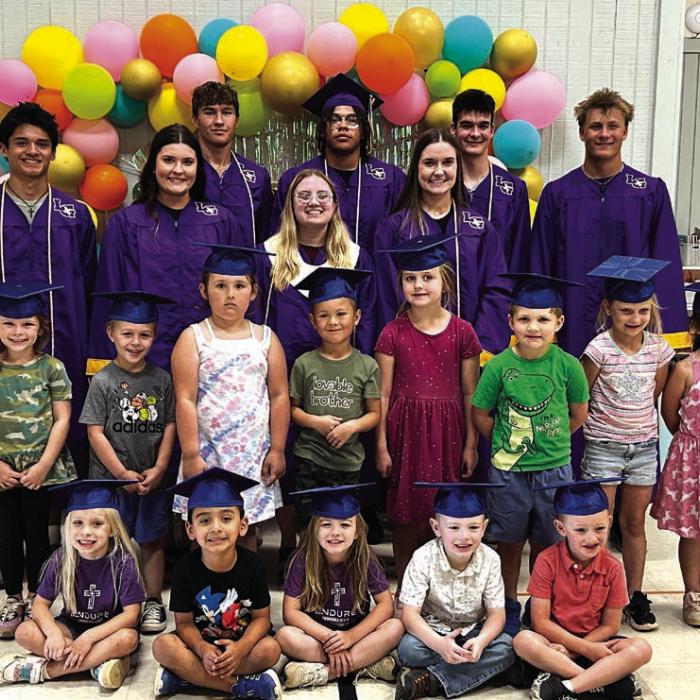 La Grange High School grads who attended Mt. Calvary returned to the school to visit with the Pre-K grads. Front row of the seniors (Left to Right): Orlando Solorzano, Madeline Willrich, Autumn Wolf, Jodi Kaspar; Back row: Gavin Hollek, Devonte McKenzie, John Kaspar, Hunter Sabo.