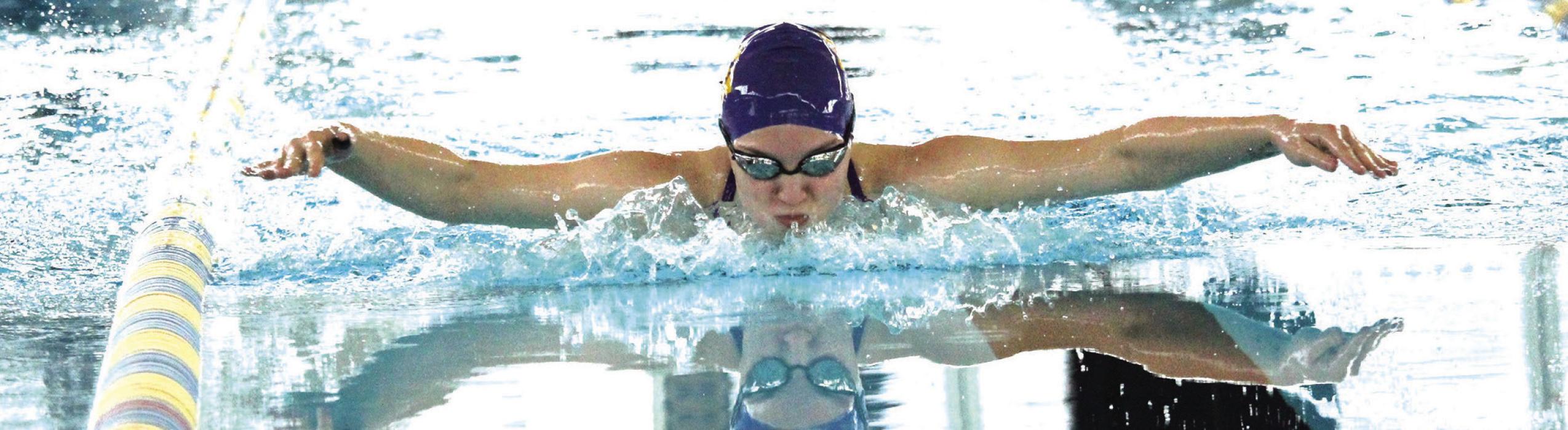 La Grange’s Hope Michalke swimming the butterfly at district.