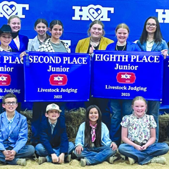 Pictured from from left, sitting: Tate Fritsch, Rowdy Guenther, Emma Zwescpher and Abigale McBride; back row: Dylan Zwescpher, Abraham McBride, Holden Holub, Crockett Guenther, Julia Melton, Laramie Laake, Adalyn Carrales, Rheagan Karisch, Kaisley Janecka, Tatum Fritsch, Rilan Karisch, Hudson Holub, and Coach Kaci Carrales.