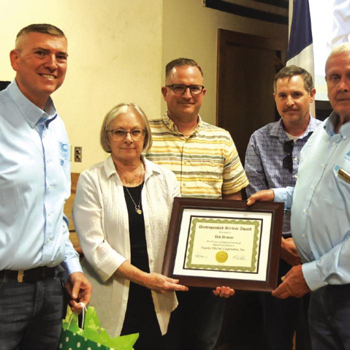 The board also remembered Bill Briscoe, a 19-year director who died in February. General Manager/ token of appreciation from the Cooperative. CEO Doug Lambert presented the Briscoe Family with a distinguished service award and a