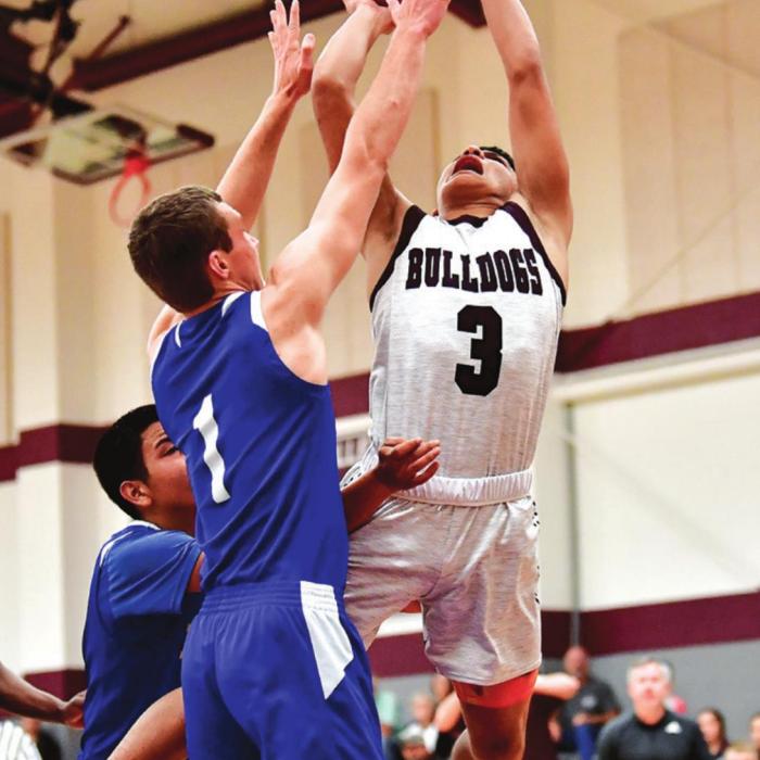 Flatonia’s Fidel Venegas goes up strong for the shot in a December victory over #5-ranked Dime Box. Photo by Stephanie Steinhauser