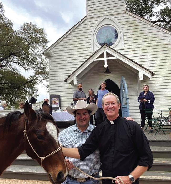 William “Father Bill” Miller, one of St. Cecilia’s founders and pastor is shown here, right, during the Blessing of the Animals event last year at the church.