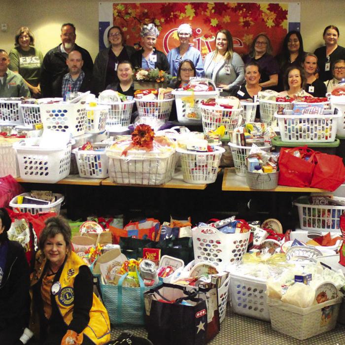 Some of the donors of more than 130 Thanksgiving meal baskets are shown here Thursday at St. Mark’s Medical Center. The baskets were heading to needy families in a four county area. Photos by Jeff Wick