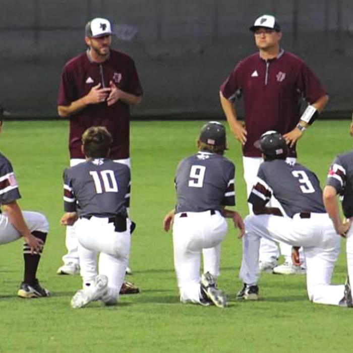 Fayetteville head coach Clint Jaeger talks to his team after Thursday’s playoff victory. Photo by Amy Fritsch