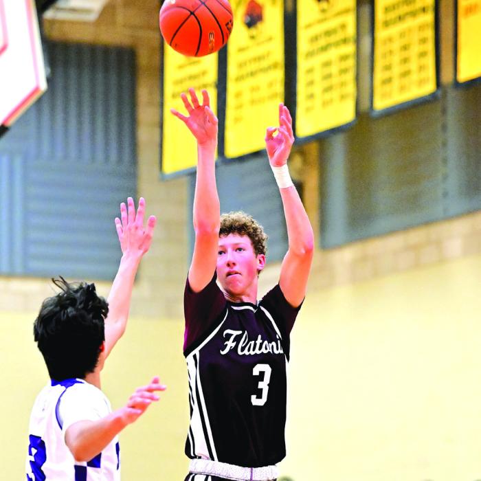 Camden Bosl puts up a three-pointer for the Flatonia Bulldogs in their bidistrict playoff win Monday night. Flatonia defeated Thrall 89-56. Photo by Stephanie Steinhauser