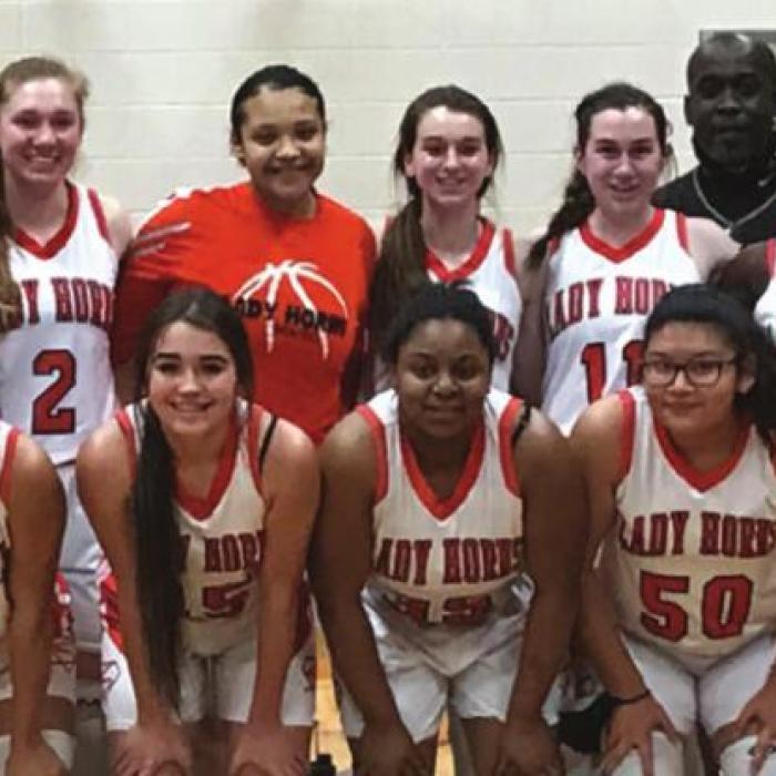 The members of the Lady Horns pose after Friday’s victory.