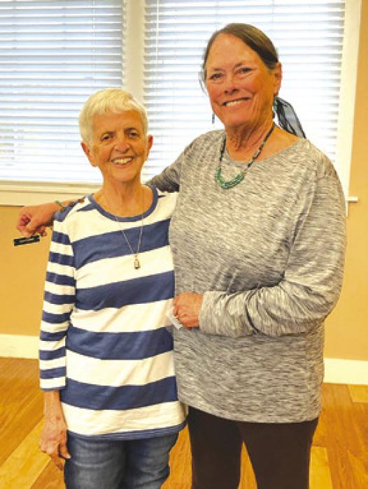 Left to right, Joyce Caddell receives her Auxiliary service pin for 3,500 hours shared from Mary Kahanek, Auxiliary president.