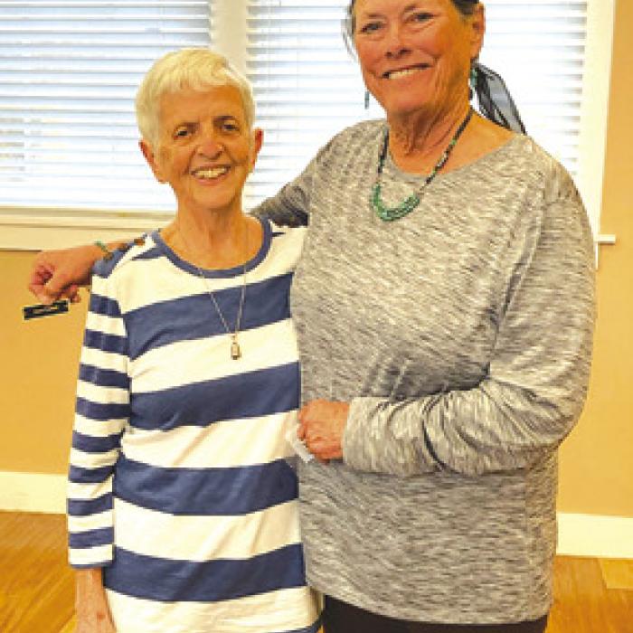 Left to right, Joyce Caddell receives her Auxiliary service pin for 3,500 hours shared from Mary Kahanek, Auxiliary president.