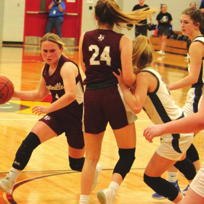 Fayetteville’s Emma Jurecka dribbles around a pick set by teammate Marissa Rohde in Friday’s game. Jurecka scored 23.