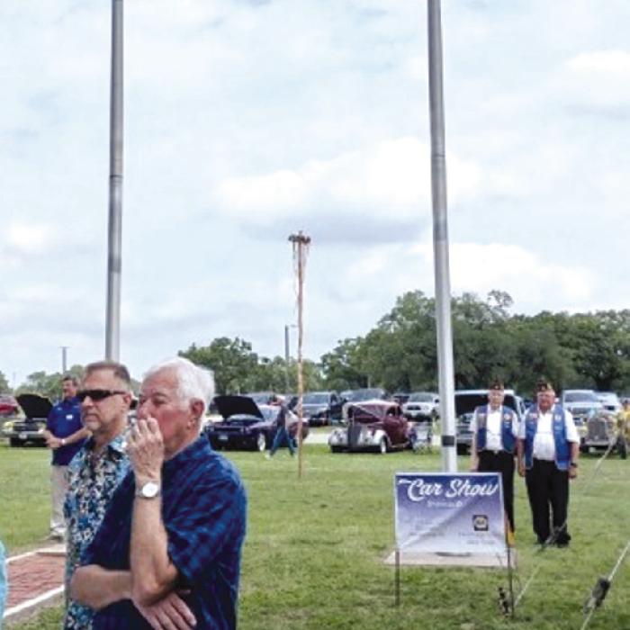 Schulenburg American Legion Post 143 raised the flag for the “Slavnost” May Fest on May 18 at the Texas Czech Heritage and Cultural Center in La Grange. Pictured in uniform near the flag pole is Sergeant at Arms Harry Bartosch and Adjutant Dennis Muhlstein. Not pictured is Commander Bob Heinrich, who lead the Pledge of Allegiance from the stage.