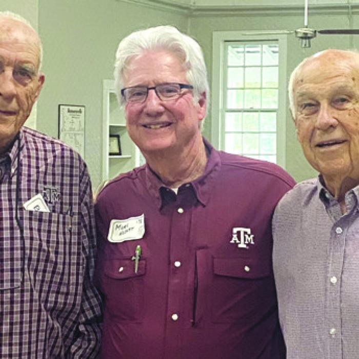 Aggie Tradition, first in meal line are oldest class from left: Vernon L. “Chick” Hohensee, ‘57, of Fayetteville; Mark Hebert, ‘78, of La Grange; and William L. “Bill” Appelt, ‘58, of Hallettsville.
