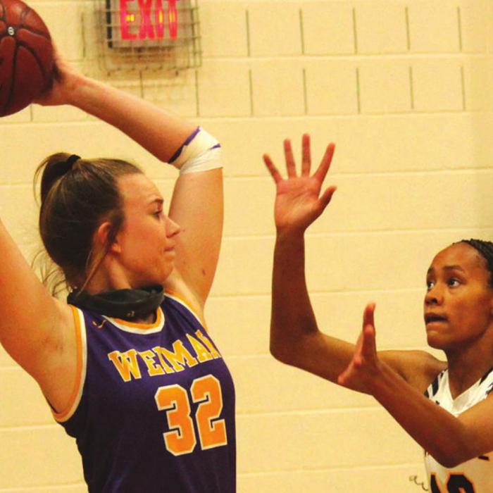 La Grange’s Aysia Grant plays defense against Weimar’s Skylar Heger. Photos by Jeff Wick