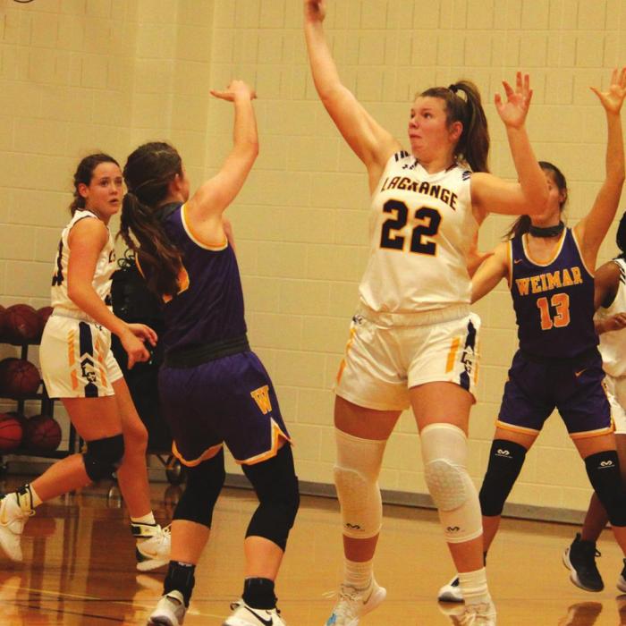La Grange’s Ashlynn Golan snags a pass attempt by Weimar Tuesday.