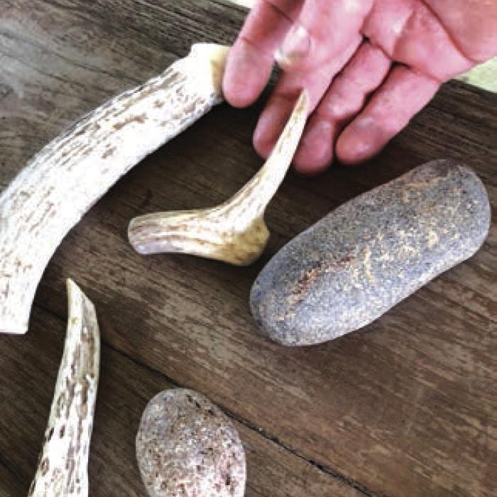 Native Americans knapped arrowheads, spears, and knives using handmade tools like these and rocks. David follows their example. Modern knapping tools have long-lasting copper tips. Called a copper bopper, the big one is used to break the rock. The other tools are used to flake and file the edges.