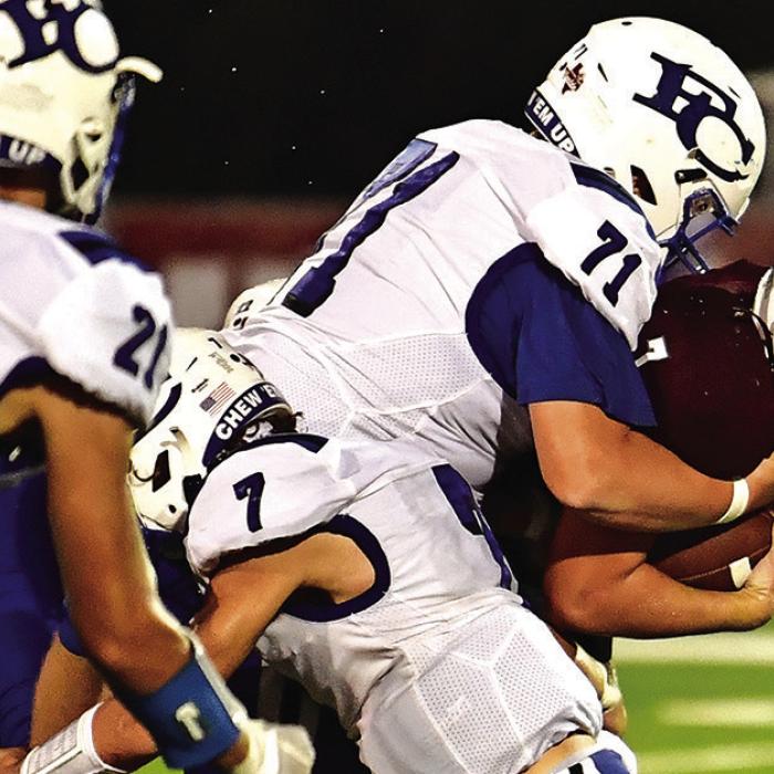 Dayton Cliffe pushes through to pick up the first down for the Flatonia Bulldogs Friday night against Falls City. Photo by Stephanie Steinhauser