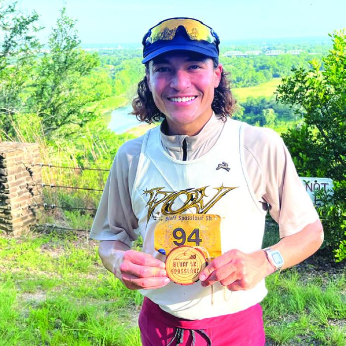 Aaron Albert of Houston won the Spasslauf 5K that kicked off the Schuetzenfest festivities May 16 in La Grange. This was his first time running in the La Grange race. He ran the challenging course, which started at the KC Hall in La Grange and then went past the Colorado River, Bucker’s Creek and around the golf course before going up the bluff, in a time of 17:16. Photo by Jeff Wick