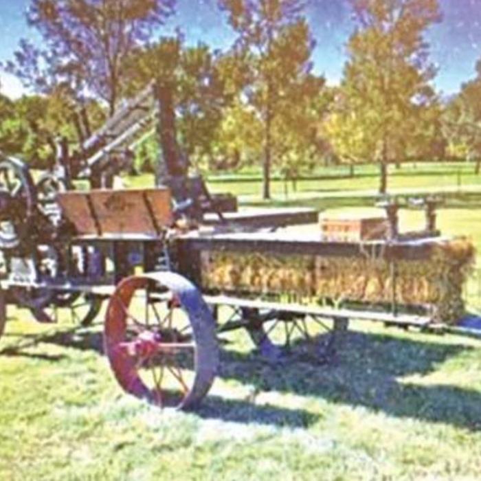 Here is a picture of a press just like the one in this story. This 1913 Rumely baler is part of a collection owned by Jesse Boller Ashland.