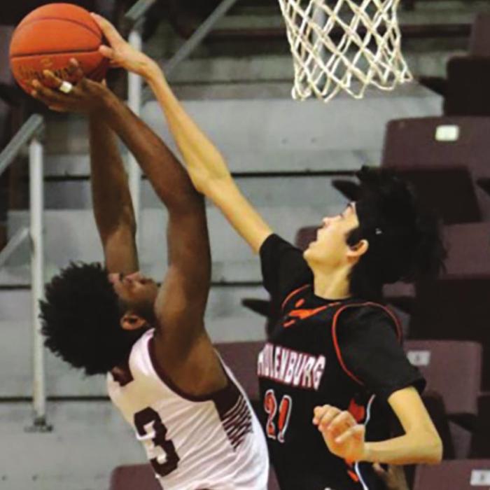 Schulenburg’s Alex Lozano blocks this shot by a Grapeland player in Tuesday night’s state semifinal. Photo by Audrey Kristynik