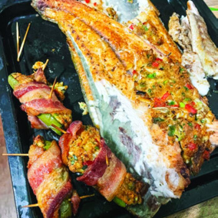 Grilled redfish on the halfshell with some crab-stuffed jalepeno poppers.