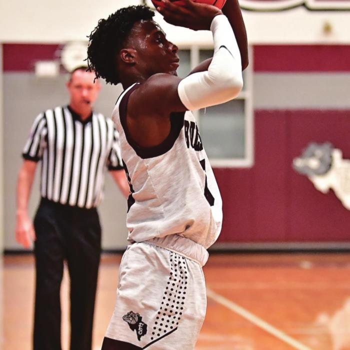 Keyshaun Green nails a three point shot in the 66-64 win over Dime Box on Dec. 21. Photo by Stephanie Steinhauser