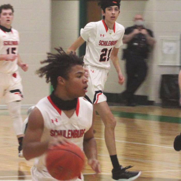 Schulenburg’s Keisean Johnson leads a fast break in Monday’s game. Photo by Brian Pierson