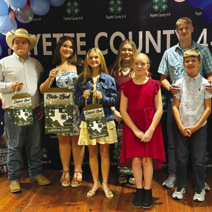 Pure Country 4-H Club posed after receiving their pins and awards from the preceding year. Pictured here is Rilan Karisch, Addison Eichler, Brylee Brugger, Rheagan Karisch, Abbie Eichler, Haygen Mings and Tucker Mings.