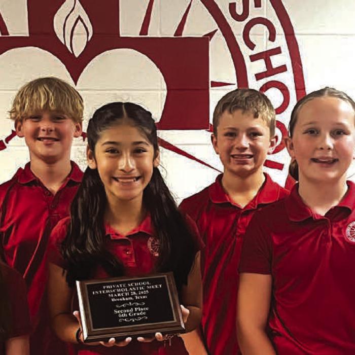 Shown here are the Sacred Heart 6th graders with their plaque for winning second place overall among all the 6th grade classes competing.