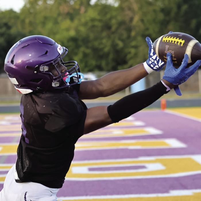 La Grange’s Dillan Johnson reaches out to haul in this touchdown pass during Thursday’s preseason scrimmage against Franklin at Leopard Stadium. Photo by Darrell D. Gest