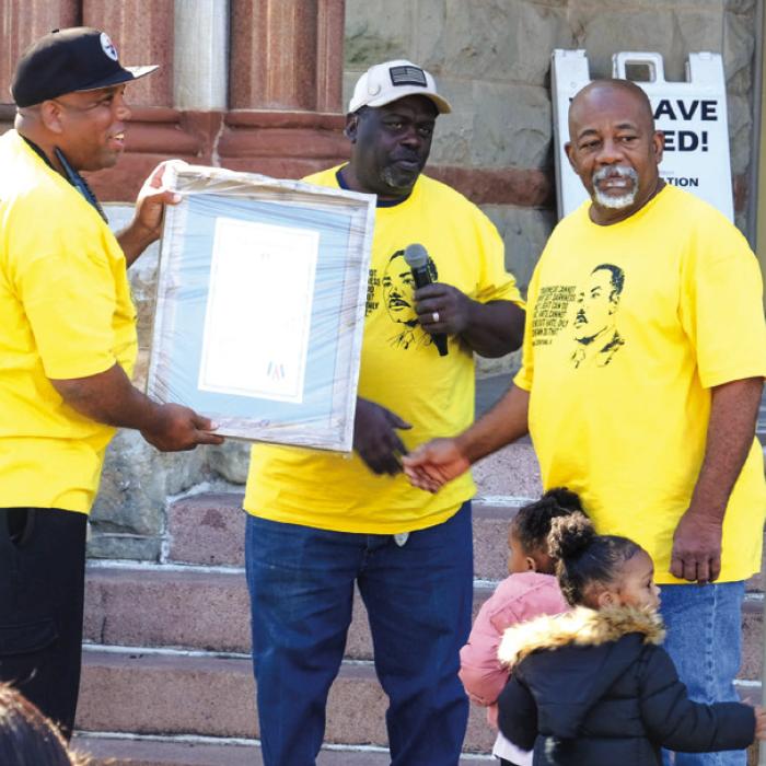 From left, La Grange Juneteenth Committee President Walter Culberson and past president Jonathan Ellis present a proclamation to Bennie Ray Steward recognizing him for many years of service to the African-American community in Fayette County. Photo by Andy Behlen