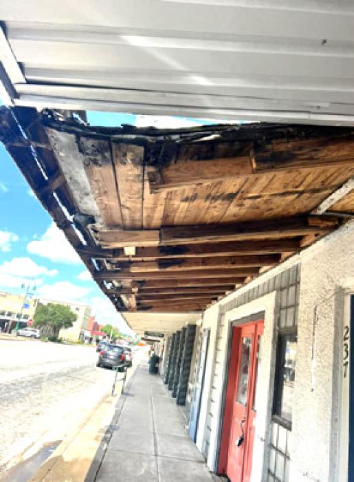 Rotten Awning on the Square Draws Attention